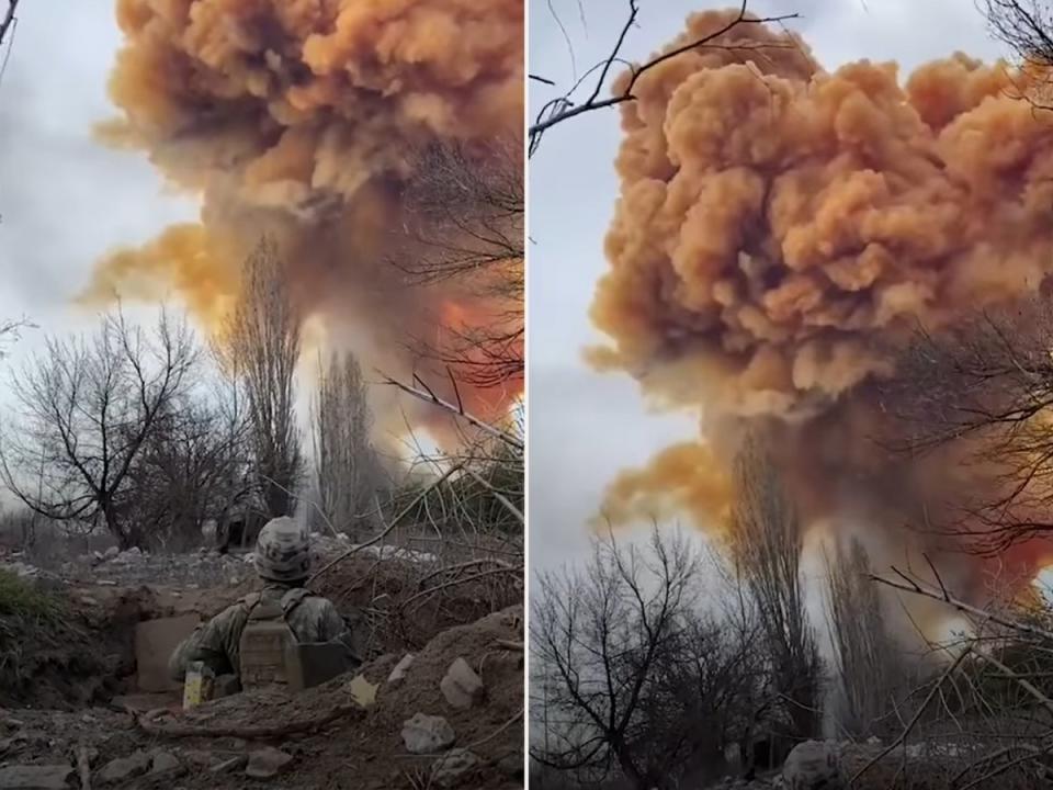 A soldier watches on as nitric acid rises into the sky (YouTube)