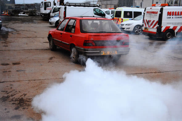 Simon Chaplin, 62 a driver who had a James Bond Style smokescreen device fitted to his car.Pictured here is the smokescren in  actionÂ© WALES NEWS SERVICE 