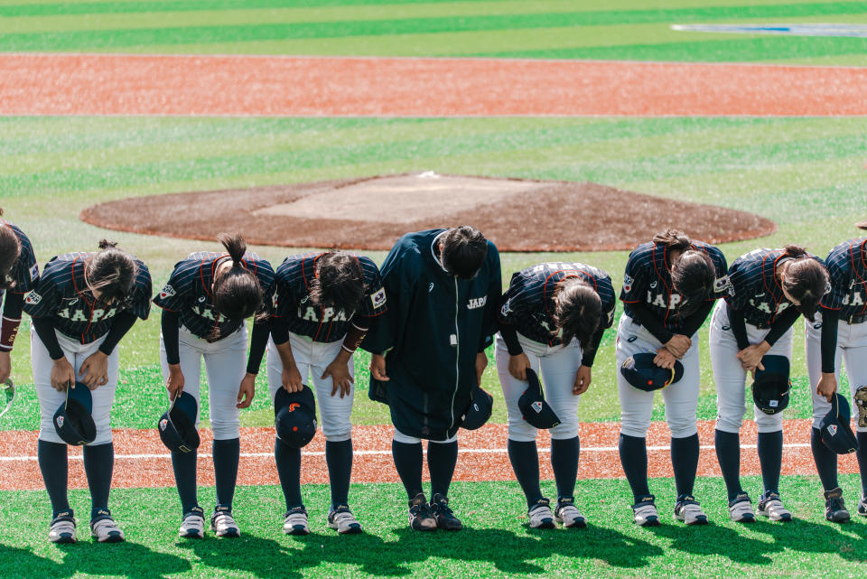 Team Japan bows during a game against Hong Kong at the Women's Baseball World Cup. (Photo: WBSC)
