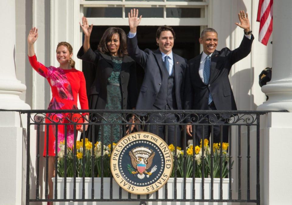 President Barack Obama and first lady Michelle Obama wave with Canadian Prime MinisterJustin Trudeau, and his wife Sophie Gregoire, on the Truman Balcony during an arrival ceremony on the South Lawn of the White House in Washington, Thursday, March 10, 2016. (AP Photo/Andrew Harnik)