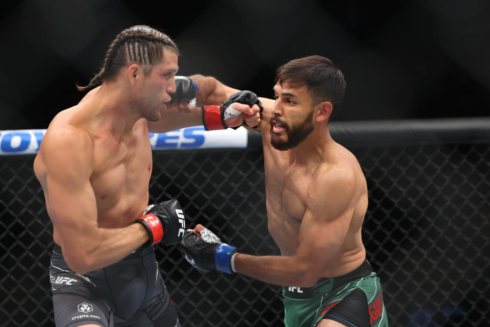 Jul 16, 2022; Elmont, New York, USA; Brian Ortega (red gloves) fights Yair Rodriguez (blue gloves) during UFC Fight Night at UBS Arena. Mandatory Credit: Ed Mulholland-USA TODAY Sports