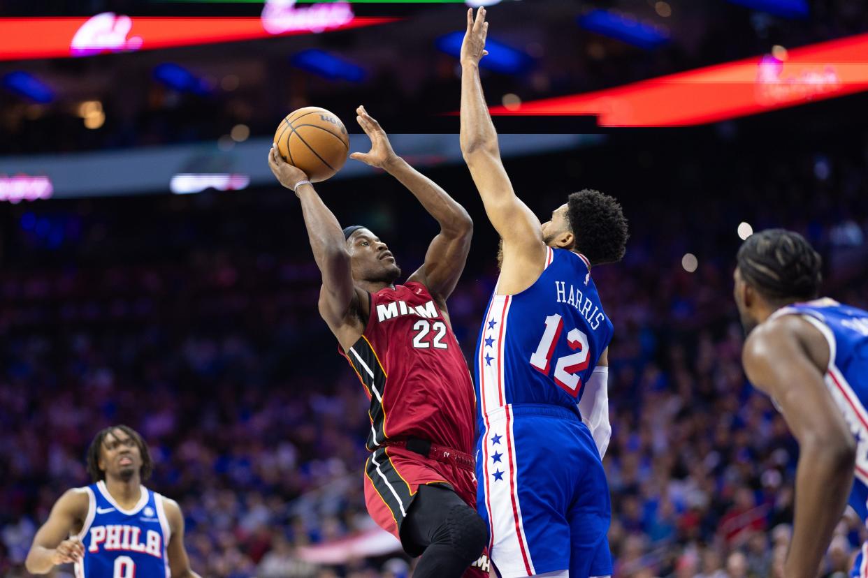 Apr 17, 2024; Philadelphia, Pennsylvania, USA; Miami Heat forward Jimmy Butler (22) drives for a shot against Philadelphia 76ers forward Tobias Harris (12) during the second quarter of a play-in game of the 2024 NBA playoffs at Wells Fargo Center. Mandatory Credit: Bill Streicher-USA TODAY Sports