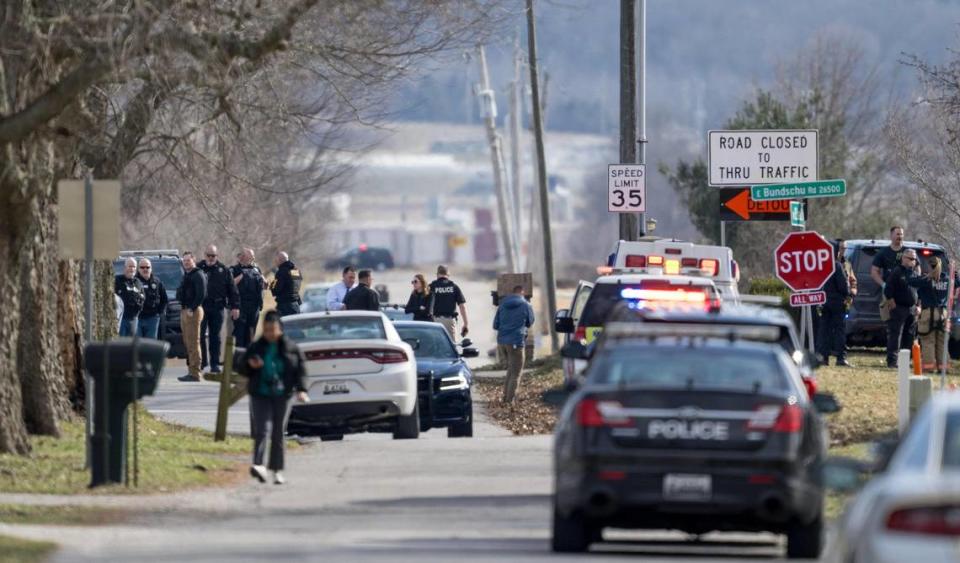 Law enforcement officials and medical personnel work the scene of an officer involved shooting near the intersection of Elsea Smith Road and Bundschu Road on Thursday, Feb. 29, 2024, east of Independence.