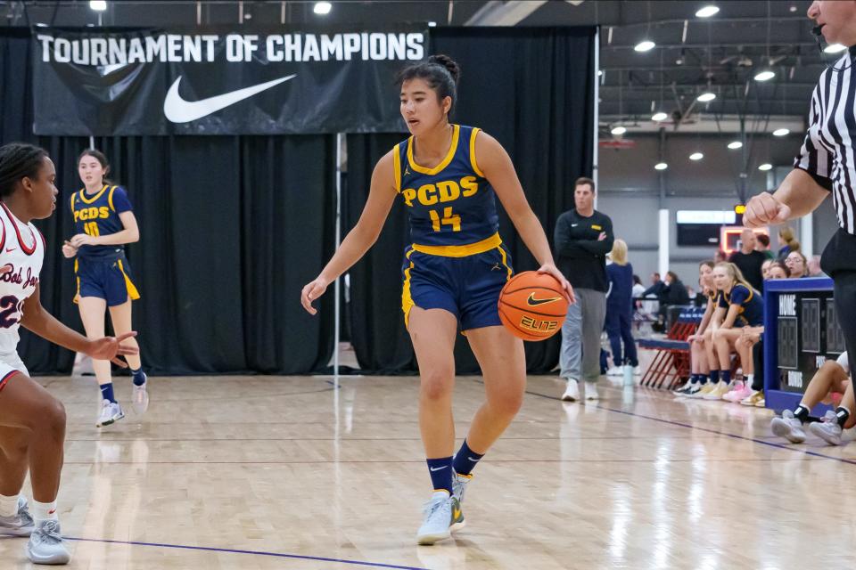 Aila Kaibara (14) of Phoenix Country Day School takes the ball down the court during a game at the Nike Tournament of Champions at Legacy Sports Park on Dec. 18, 2023, in Mesa.