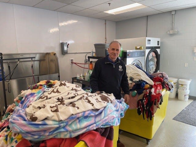 Keeping the 35 dogs, their kennels and blankets clean is a constant task for staff at the Rhode Island Society for the Prevention of Cruelty to Animals. Wayne Kezirian, president, says two large bins of laundry are done daily, but acknowledges he doesn't do the laundry.