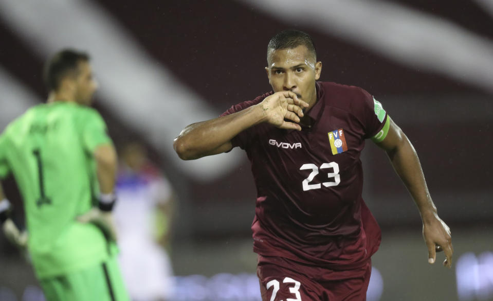 Venezuela's Salomón Rondón celebrates scoring his side's second goal against Chile during a qualifying soccer match for the FIFA World Cup Qatar 2022 in Caracas, Venezuela, Tuesday, Nov. 17, 2020. (Miguel Gutierrez, Pool via AP)