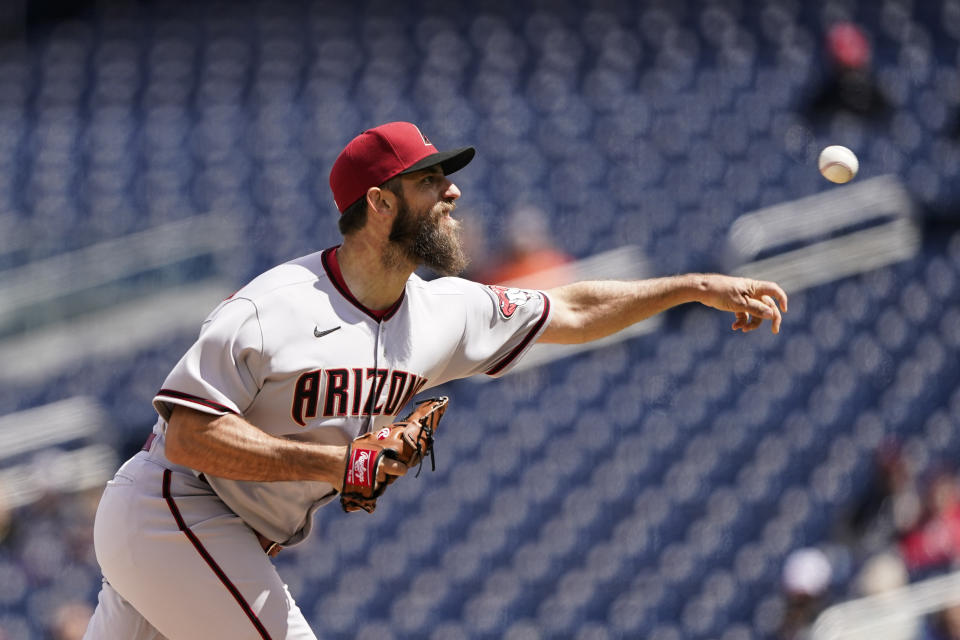 Arizona Diamondbacks starting pitcher Madison Bumgarner throws during the third inning in the first game of a baseball doubleheader against the Washington Nationals at Nationals Park, Tuesday, April 19, 2022, in Washington. (AP Photo/Alex Brandon)