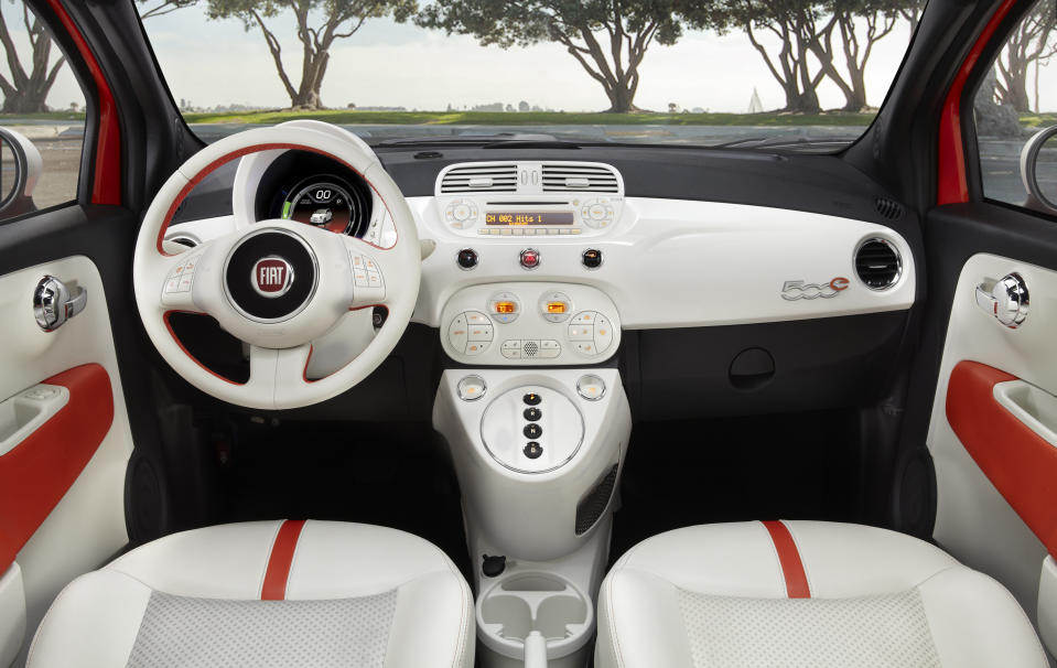 This undated image provided by Fiat shows the 2013 Fiat 500e mini-car, which will be appearing at the Los Angeles Auto Show this week. The “500e” is the brand’s first all-electric model in the U.S. while the “500L” comes with four doors and significantly more room than a regular model. The first 500 hit U.S. showrooms two years ago, promising a stylish and fuel-efficient remake of the 1950s original. But the car needs to boost its allure in the U.S., where sales remain pint-sized compared with the rest of the world. (AP Photo/Fiat)