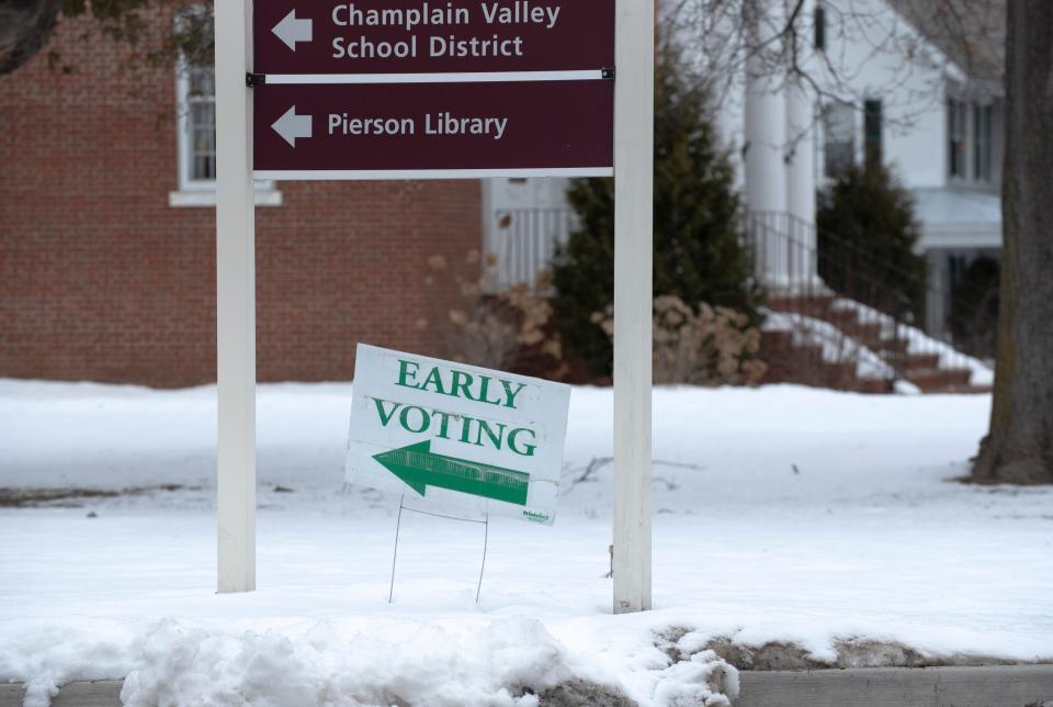 A sign at the entrance to Shelburne town hall directs voters toward where they can drop off early voting ballots on Town Meeting Day, Tuesday, March 7, 2023.