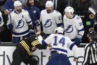 Tampa Bay Lightning's Pat Maroon (14) and Boston Bruins' Garnet Hathaway (21) fight during the first period of an NHL hockey game, Saturday, March 25, 2023, in Boston. (AP Photo/Michael Dwyer)