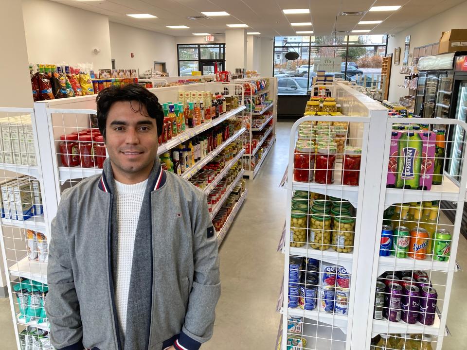 Wazir Hashimi, owner of Ariana Natural Market, stands inside the Essex Junction store Nov. 27, 2023.