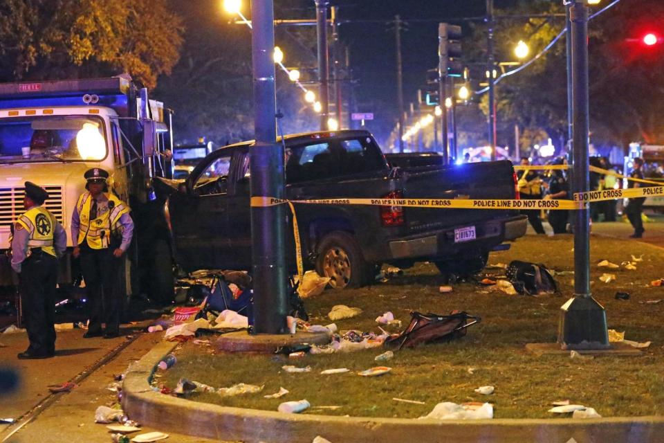 Investigation: Police stand next to the pickup truck (AP)