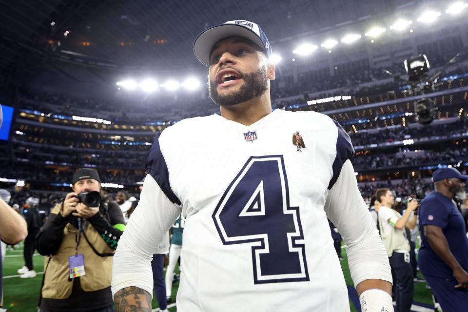 Dec 10, 2023; Arlington, Texas, USA; Dallas Cowboys quarterback Dak Prescott (4) smiles on the field after the game against the Philadelphia Eagles at AT&T Stadium. Mandatory Credit: Tim Heitman-USA TODAY Sports