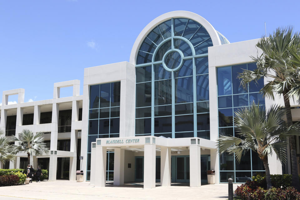 In this Thursday, May 7, 2019 photo The Neal Blaisdell Center is seen in Honolulu as officials get ready to use the large event venue for jury selection in a corruption case involving the highest levels of the city's law enforcement. The U.S. judge presiding of the case against former police chief Louis Kealoha and his wife Katherine Kealoha, a former deputy city prosecutor, is concerned the courthouse wouldn't accommodate some 400 jurors needed for the high-profile case, so he reserved a room at the center. (AP Photo/Jennifer Sinco Kelleher)