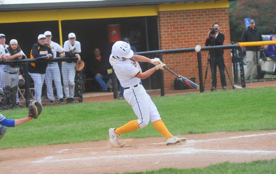 Colonel Crawford's Micah Thomas pops a ball up in the infield.