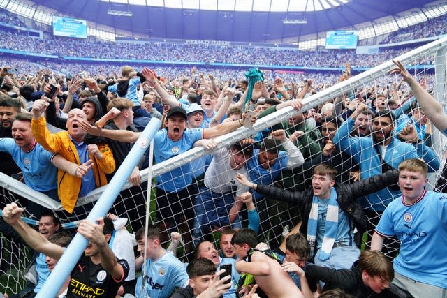 Manchester City fans invade the pitch after their side were crowned Premier League champions on a dramatic final day of the season. City fell 2-0 behind at home to Aston Villa to give rivals Liverpool hope of pipping them to the title. But Pep Guardiola's side scored three times in a spellbinding six-minute period to claim a crucial 3-2 success, prompting jubilant scenes at the Etihad Stadium