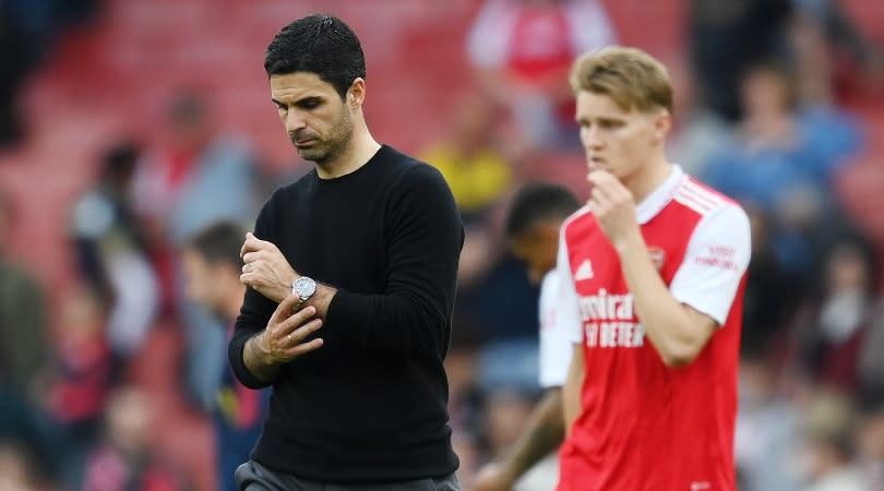 Arsenal manager Mikel Arteta and captain Martin Odegaard look dejected during the Gunners' 3-0 loss to Brighton in May 2023.