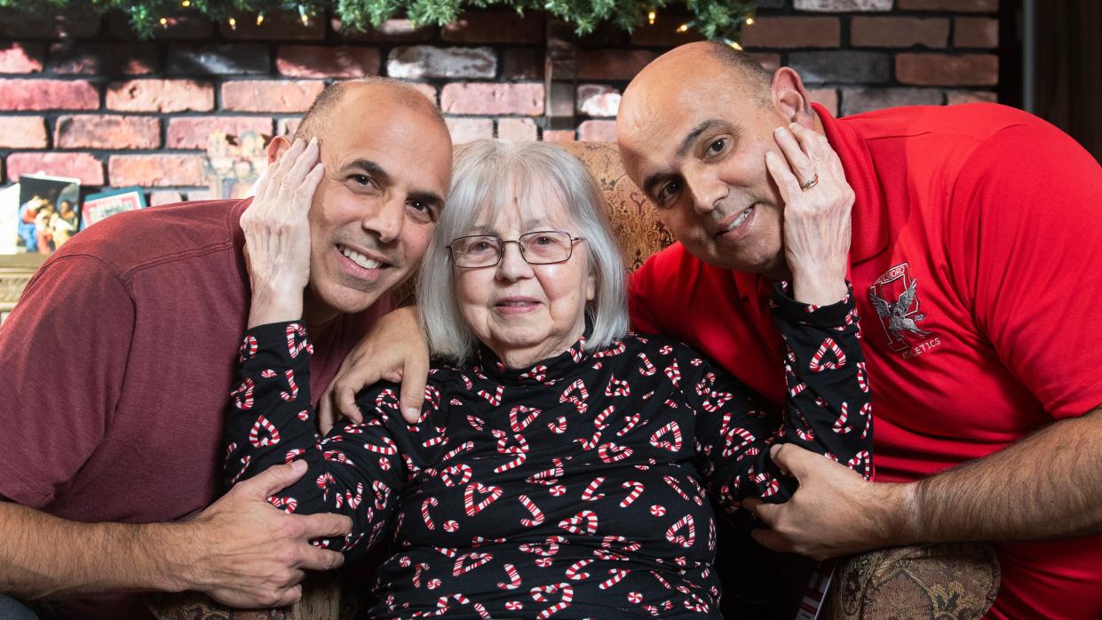 Greenwich Township Mayor Vince Giovannitti, left, and brother John Giovannitti, mayor-elect of Paulsboro, right, sit with their mother Adina Giovannitti in her Paulsboro home.