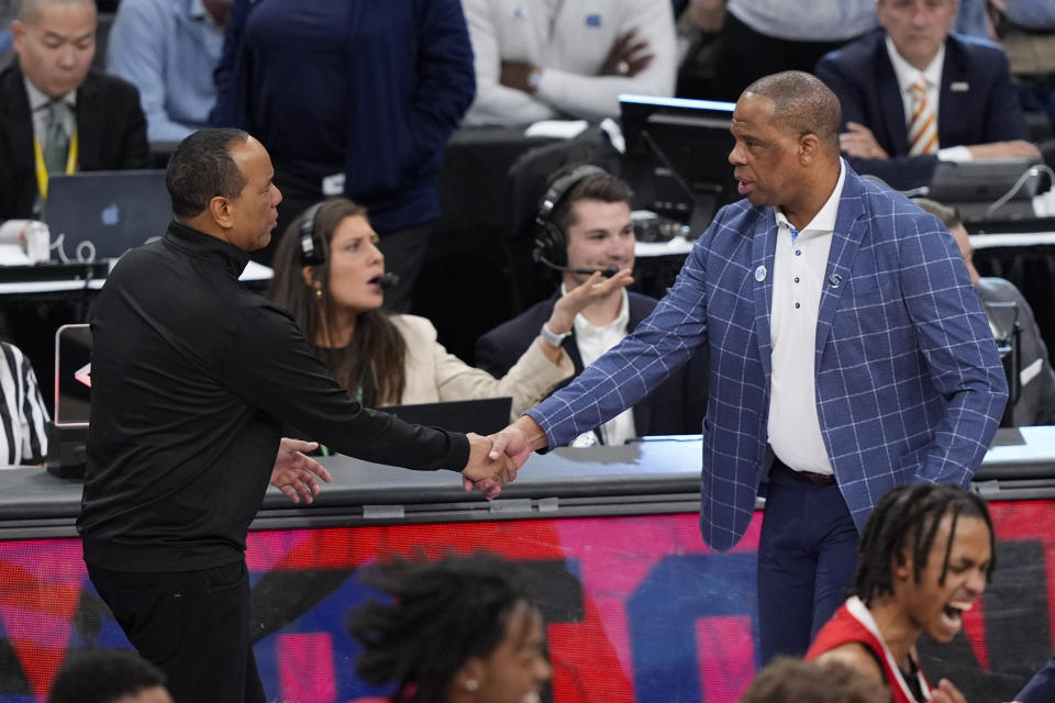 North Carolina head coach Hubert Davis, right, and North Carolina State head coach Kevin Keatts, left, shaking hands after North Carolina lost in an NCAA college basketball championship game of the Atlantic Coast Conference tournament, Saturday, March 16, 2024, in Washington. North Carolina State won 73-65. (AP Photo/Susan Walsh)