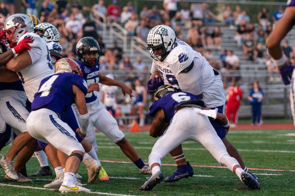 Omar Rackley (far right, white jersey) blocks in the Bellamy and Sons Paving Marisa Rose Bowl on June 29, 2023