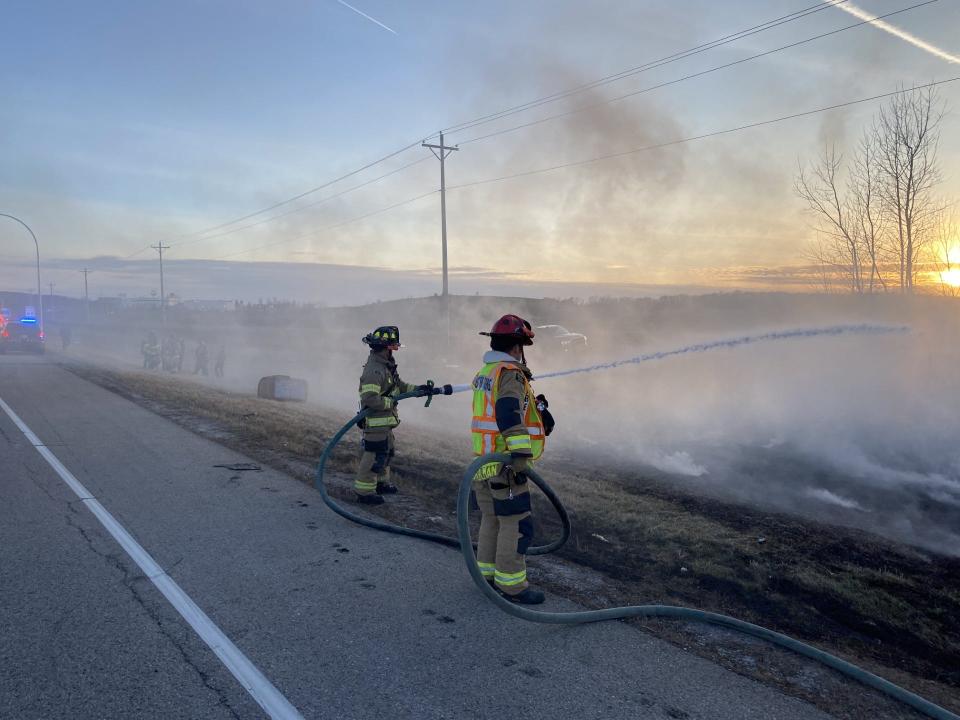 Firefighters put out a brush fire that occurred after a hot air balloon crash. The balloon hit a power line and the basket disconnected from the balloon. The people in the basket only reported minor injuries.