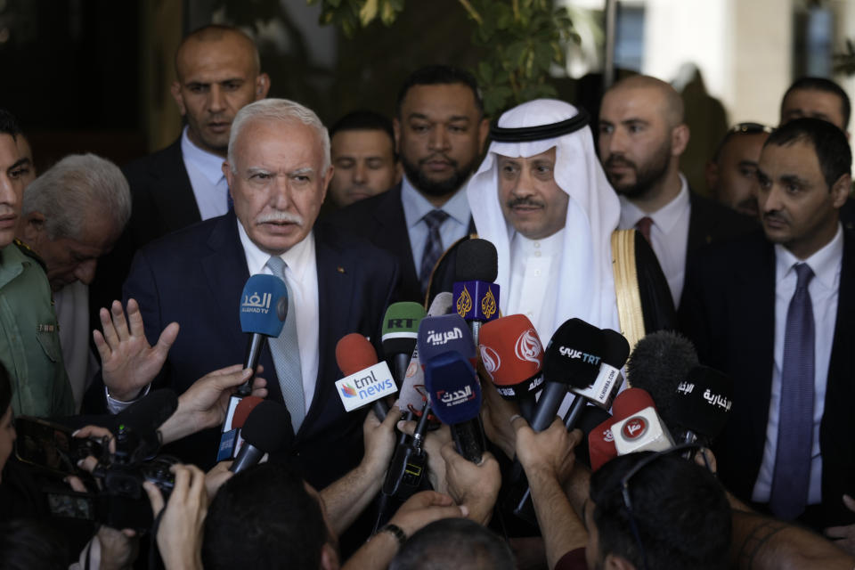 Nayef al-Sudairi, Saudi Arabia's the first-ever Saudi ambassador to the Palestinian Authority, right, and Palestinian Minister of Foreign Affairs and Expatriates, Dr. Riyad Al-Maliki, left, make a joint statement after their meeting in Ramallah, Tuesday, Sept. 26, 2023. Al-Sudairi visited the Palestinian territories Tuesday to discuss the burgeoning Saudi-Israeli normalization deal, which the kingdom has said will hinge on what concessions Israel is willing to grant the Palestinians. (AP Photo/Majdi Mohammed)