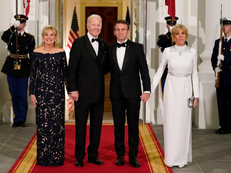 The Bidens and the Macrons pose for a photo at the White House.