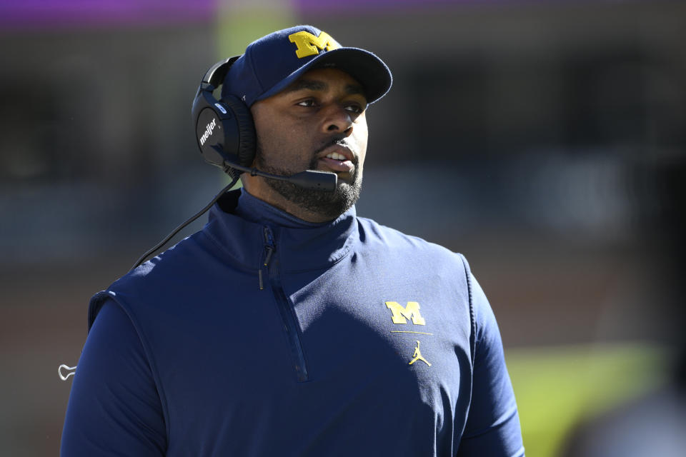 Michigan acting coach Sherrone Moore watches play during the first half of the team's NCAA college football game against Maryland, Nov. 18, 2023, in College Park, Md. Moore will have a lot of decisions to make in his first season as Michigan's coach, leading the defending national champions after Jim Harbaugh bolted to coach the Los Angeles Chargers. Whom he chooses to start at quarterback will be potentially pivotal. AP Photo/Nick Wass, File)