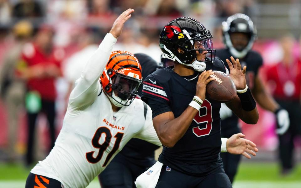 Oct 8, 2023; Glendale, Arizona, USA; Cincinnati Bengals defensive end Trey Hendrickson (91) forces a fumble on Arizona Cardinals quarterback Joshua Dobbs (9) in the second half at State Farm Stadium. Mandatory Credit: Mark J. Rebilas-USA TODAY Sports