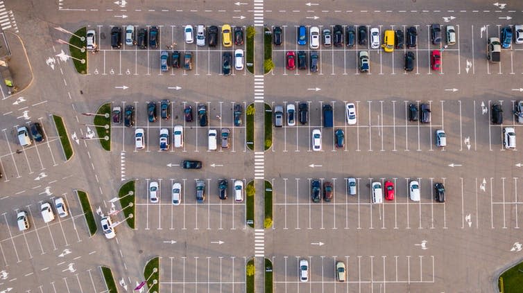 <span class="caption">Asphalt-covered cities are hardly drainage-friendly.</span> <span class="attribution"><a class="link " href="https://www.shutterstock.com/image-photo/car-parking-viewed-above-aerial-view-476995468?src=tlc6MgGcvbhE1ivZn9Xn4g-1-18&studio=1" rel="nofollow noopener" target="_blank" data-ylk="slk:Lals stock/Shutterstock.com;elm:context_link;itc:0;sec:content-canvas">Lals stock/Shutterstock.com</a></span>