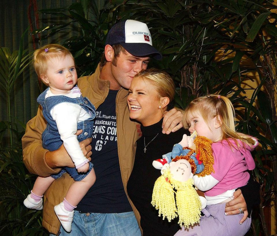 'I'm A Celebrity: Get Me Out Of Here' winner and queen of the jungle Kerry McFadden returns home to Dublin to be greeted by husband Bryan and daughters Molly (2) and Lilly (1) on February 15, 2004 (Getty Images)