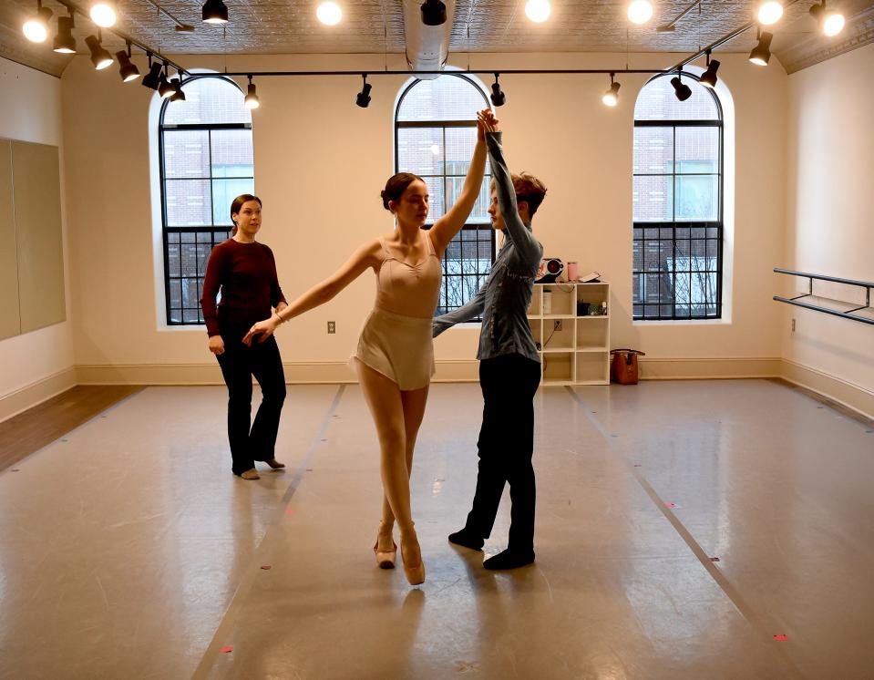 River Raisin Ballet Co. co-director Melissa Moore watches rehearsals for the upcoming production of the ballet "Aladdin" in the new Washington Street building. Shown are Kynzie Riegel as Jasmine and Nathan Glover as Aladdin.