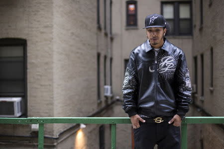 Gregory Gonzalez, 25, poses for a photograph at a friend's apartment complex in the Bronx borough of New York, October 13, 2014. Gonzalez says he was incarcerated on Rikers Island when he was 18 years-old from 2008 to 2009. Gonzalez says he was sent to Rikers for not completing community service and not paying overdue tickets. During his two months on Rikers Island, Gonzalez says he was slapped in the face and punched in his ribs by correctional officers for turning his sock inside-out incorrectly after a visit from his mother. Describing the incident Gonzalez says, "I just got slapped while my hands were on the wall, right in the face. After he slapped me, I put my hands back on the wall and they started to punch me in my ribs and my body and I fell to the ground." Gregory says he was told "Oh, well it happens" when he reported the incident to another officer. Rikers, one of the largest jail complexes in the country which houses around 9,800 prisoners, came under scrutiny after the Justice Department in August 2014 issued a report that described a pattern of violent abuse of male inmates aged 16 to 18 by jail staff. In response to questions from Reuters, a spokesman for Rikers Island Department of Correction (DOC) said that, "Since Commissioner (Joseph) Ponte's appointment last year, he has significantly reformed the care and custody of adolescent inmates, resulting in substantial decline in violence in the adolescent facility." The spokesman added that safety for staff and inmates is Commissioner Ponte's "top priority" and that "DOC has a zero-tolerance police with regards to abuse." Reuters has been unable to independently verify the statements provided by the individual in this portrait. Picture taken October 13, 2014. REUTERS/Elizabeth Shafiroff