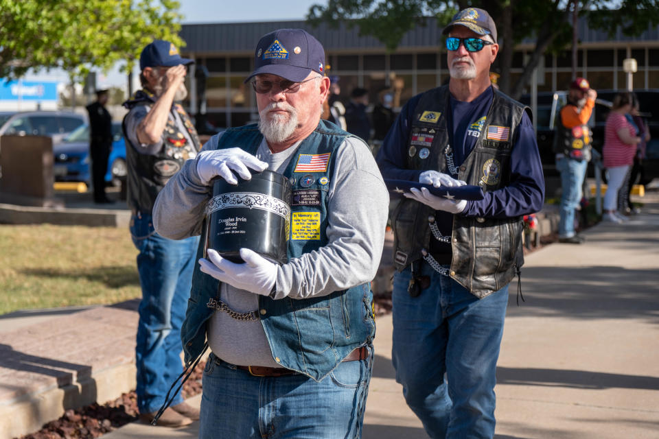Members of the Patriot Guard Riders transport the remains of U.S. Army veteran Douglas Wood  Wednesday evening during the Missing in America's Project ceremony honoring three unclaimed veterans  at the Texas Panhandle War Memorial Center in Amarillo.
