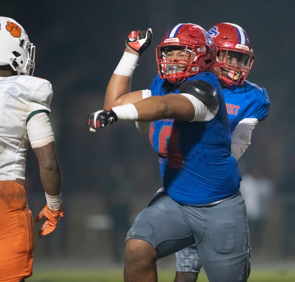 Elijah Douglas (10) celebrates a sack during the Jones vs Pine Forest playoff football game at Pine Forest High School in Pensacola on Friday, Dec. 3, 2021.  The Eagles defeated the Tigers 20-13 in overtime sending them to the state championship game.