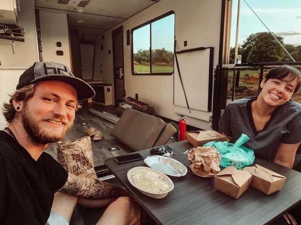 A photo of Kirsten and Devin Trout when they moved into their second RV.