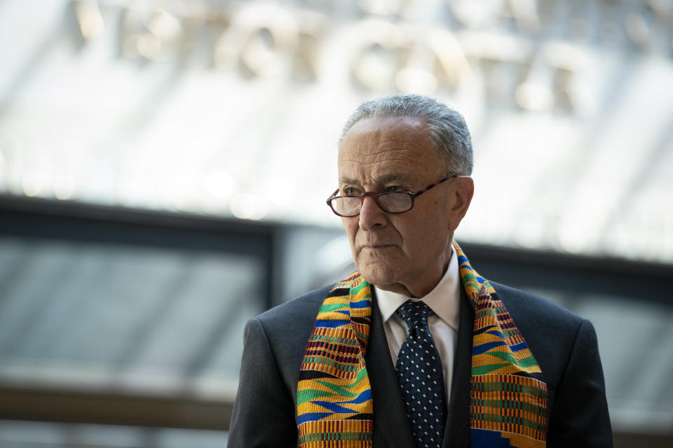 Sen. Chuck Schumer wears a kente before a moment of silence in Emancipation Hall at the U.S. Capitol. (Al Drago/Bloomberg via Getty Images)