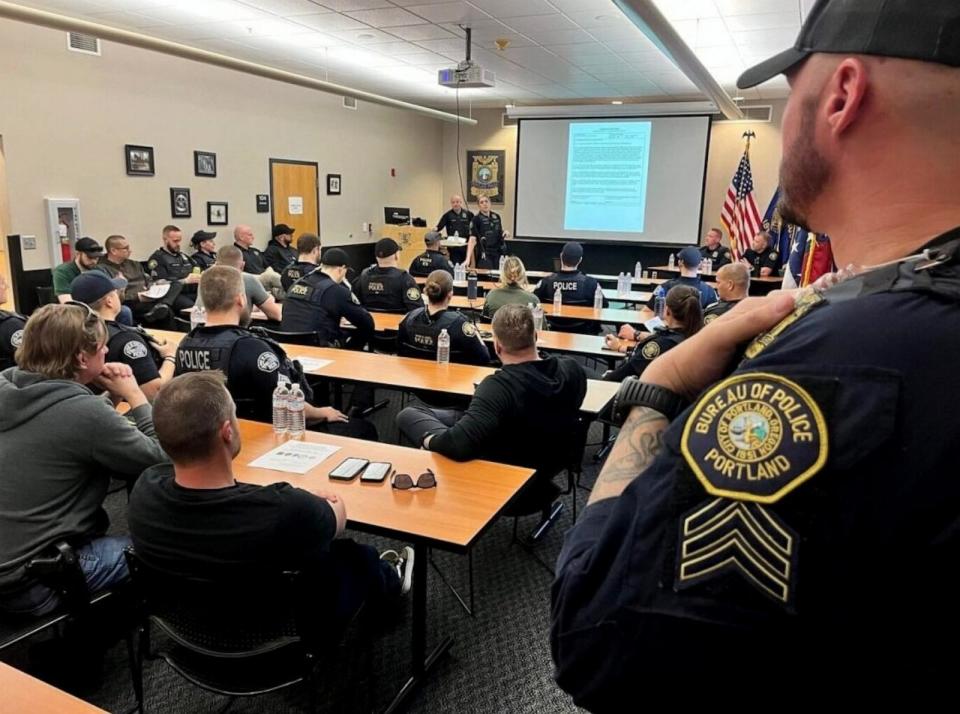 PHOTO: Portland Police officers take part in roll call before a SVO. (Portland Police Bureau)