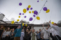 Balloons are released during a 16th birthday party for Walker Vincent at Leslie Jacob's home on Sunday, December 29, 2019 in Lafayette, La. Walker Vincent was one of the victims in the plane crash on Saturday. Family and friends threw him a birthday party where they released LSU balloons and marked gifts with their favorite memories of Walker for his father. (Brad Kemp/The Advocate via AP)