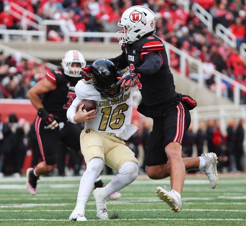 Utah Utes safety Cole Bishop (8) sacks Colorado Buffaloes quarterback Ryan Staub (16) in Salt Lake City on Saturday, Nov. 25, 2023. | Jeffrey D. Allred, Deseret News