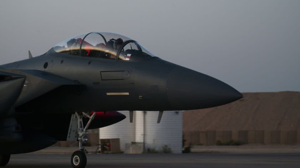 Aircrew aboard a U.S. Air Force F-15E Strike Eagle assigned to the 494th Expeditionary Fighter Squadron celebrate their arrival in the U.S. Central Command area of operations, Oct. 13, 2023 - Airman 1st Class Josephine Pepin/United States Air Forces Central