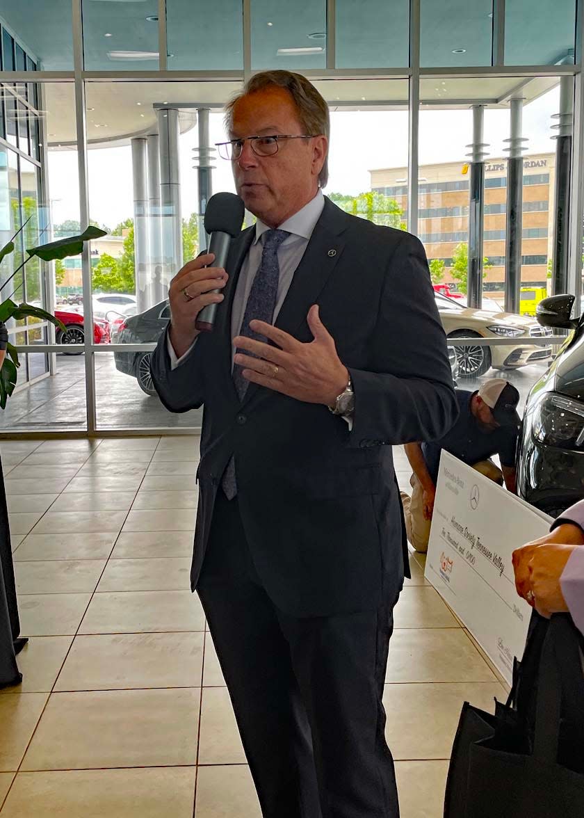 Jeff Bender, general manager of Mercedes-Benz Knoxville, addresses the crowd, saying how honored he is to donate $10,000 each to Young-Williams Animal Center and the Humane Society of Tennessee Valley on Thursday, July 21, 2022.