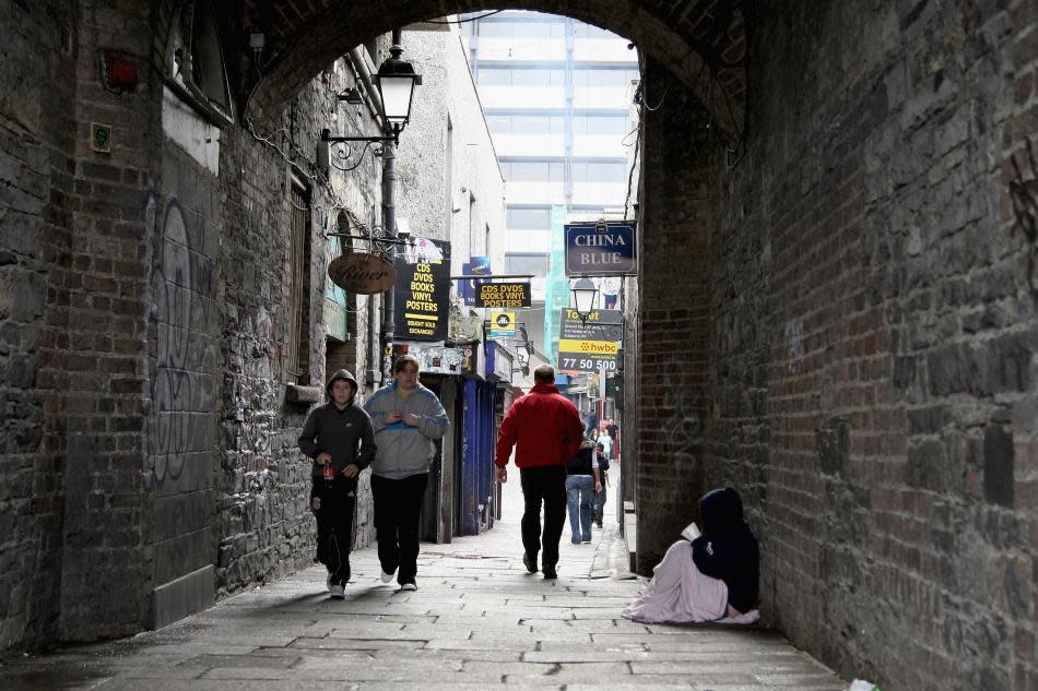 People walk through an area of Temple Bar in Dublin, Ireland.