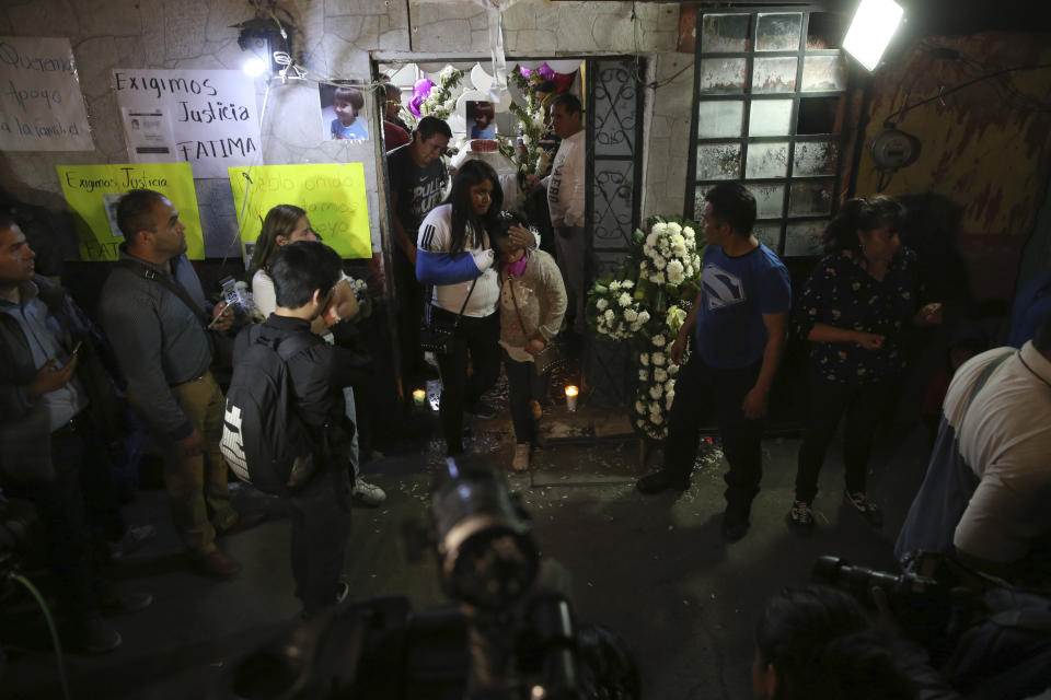 Friends and relatives attend a wake for Fatima, a 7-year-old girl who was abducted from the entrance of the Enrique C. Rebsamen primary school and later killed, her home in Mexico City, Monday, Feb. 17, 2020. Fatima's body was found wrapped in a bag and abandoned in a rural area on Saturday and was identified by genetic testing. (AP Photo/Marco Ugarte)