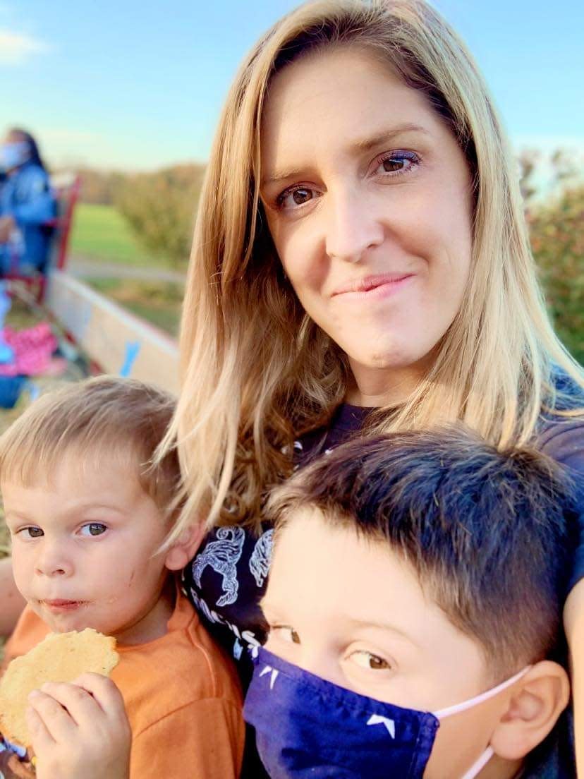Nicole Crawford with her two boys at Milburn Orchards in the fall of 2020.