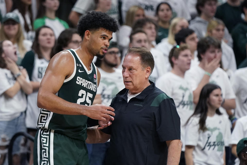 Michigan State forward Malik Hall (25) talks with head coach Tom Izzo during the second half of an NCAA college exhibition basketball game, Tuesday, Nov. 1, 2022, in East Lansing, Mich. (AP Photo/Carlos Osorio)