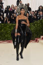 <p>She’s known to put the fashion boundaries and Solange Knowles did it again at Monday night’s Met Gala in this Iris van Herpen black strapless dress and thigh-high boots. Photo: Getty Images </p>