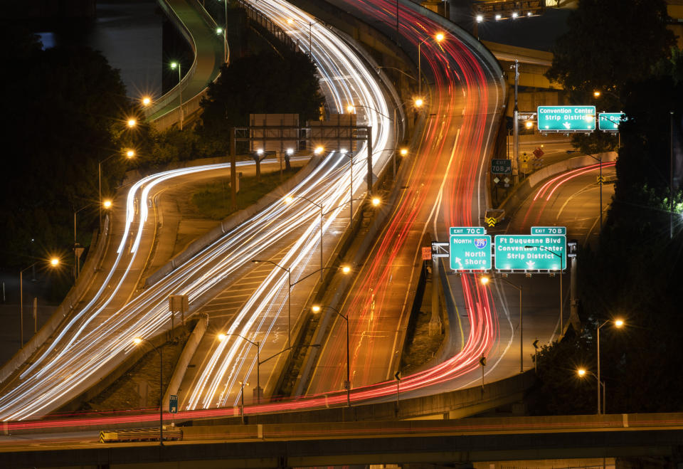 Traffic winds its way through the tangle or roads connecting the Fort Pitt Bridge with the Fort Duquesne Bridge at Pittsburgh's Point on Tuesday, Aug. 30, 2022. (Steve Mellon/Pittsburgh Post-Gazette via AP)