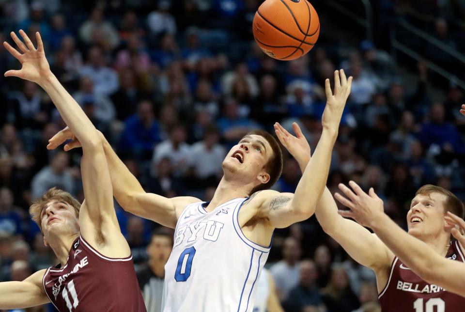 Bellarmine Knights guard Billy Smith (11), Brigham Young Cougars forward Noah Waterman (0) and Bellarmine Knights guard Garrett Tipton (10) reach for the rebound during a men’s basketball game at the Marriott Center in Provo on Friday, Dec. 22, 2023. | Kristin Murphy, Deseret News