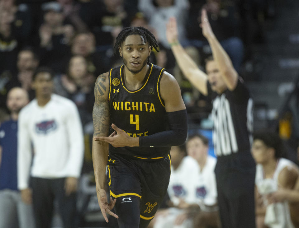 Wichita State's Colby Rogers celebrates a three-pointer during the first half of an NCAA college basketball game against Florida Atlantic on Sunday, Feb., 11, 2024, in Wichita, Kan. (Travis Heying/The Wichita Eagle via AP)